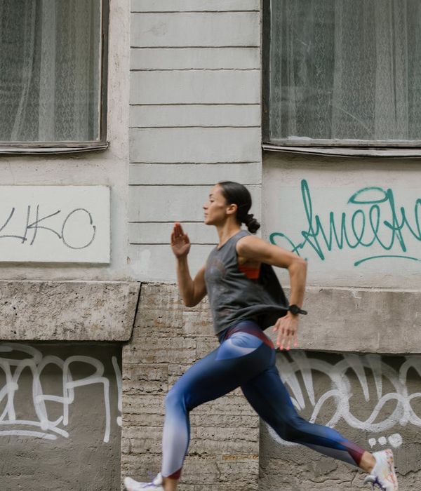Woman in activewear feeling energetic and ready for her daily cardio.